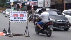 Lubang di Tengah Jalan Brigjen Katamso Tajungpinang Ganggu Pengendara